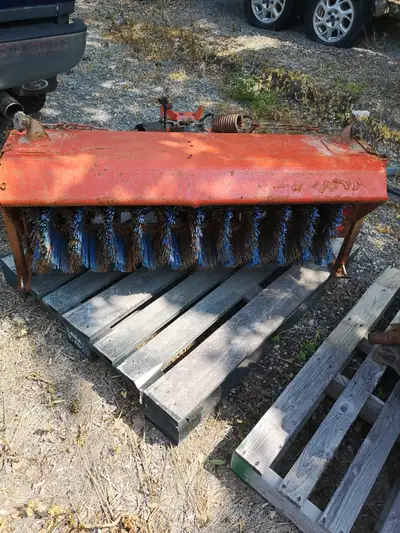 Sweeper/dethatcher. Fits BX 2350 through BX 2380 tractors. set up for snow/ice now. Very good mechan...