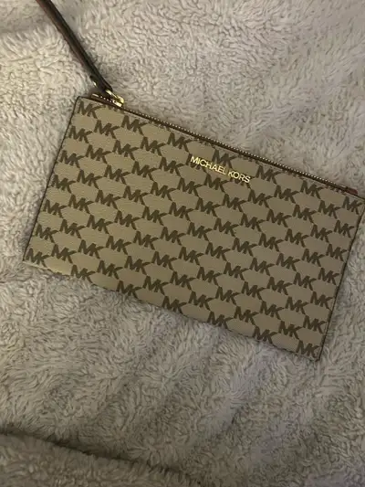 Authentic Micheal Kors wristlet, View more