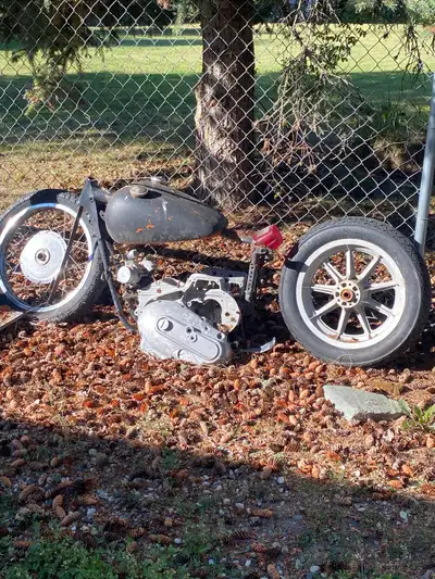 Harley parts . Frame . Bins off parts . 3 tanks ..
