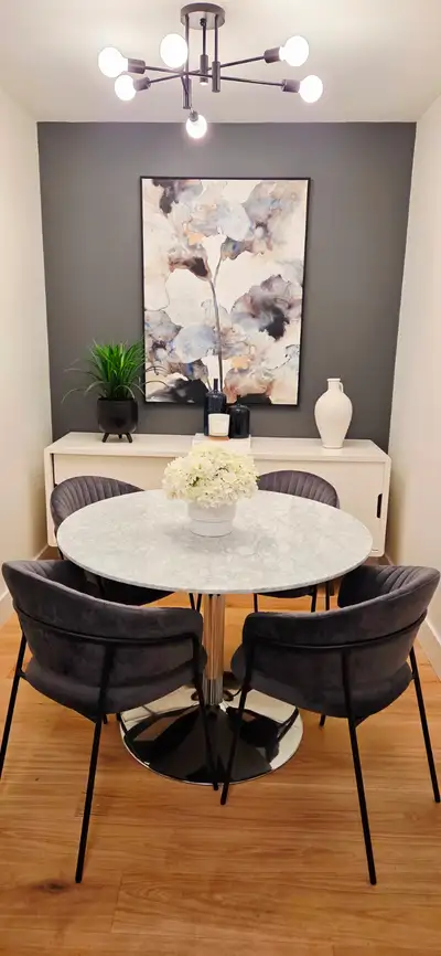 Like-new dining table and 4 velvet dining chairs in excellent condition. Beautiful marble-top table...