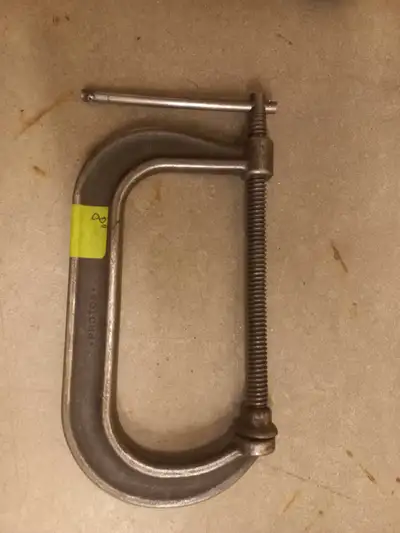 This is a heavy duty Proto 8-inch C-clamp designed for welders, in used condition. This clamp is bui...