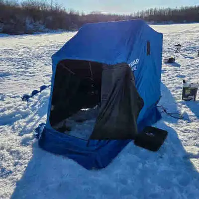 1 man flip over ice fishing hut, View more