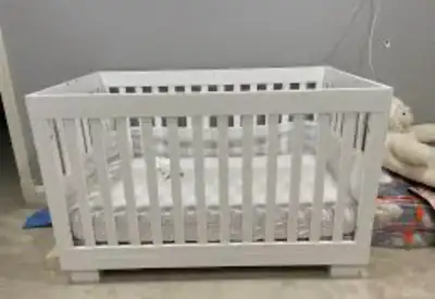 This portable mini crib is perfect for small spaces or for travel, offering a cozy and secure sleepi...