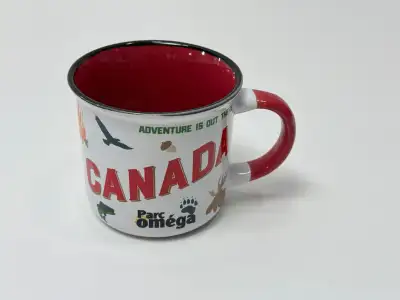 Parc Omega souvenir enamel camping mug featuring Canada wildlife graphics. White with red interior a...