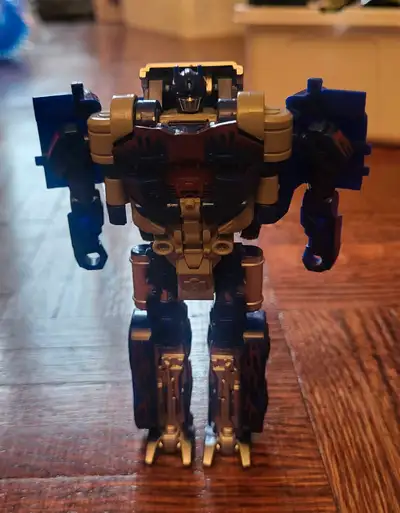 This is a Transformers Optimus Prime action figure that transforms into a truck, a must-have for any...