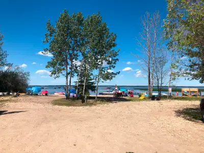 3 Lakefront Cabins for rent on beautiful Lac Ste Anne. White sandy beach and dock, playground, store...