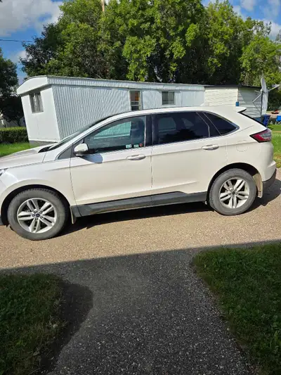 Drive home this reliable white Ford Edge SEL, AWD,featuring a spacious interior with comfortable bla...