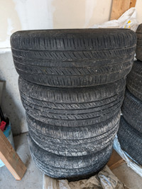 Four 2014 Chevy Cruze rims with used tires.