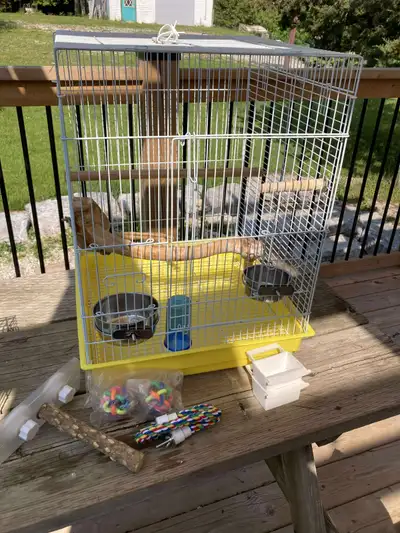 Our Bird passed so we are selling her cage. Large Cage Travel cage Good dishes 2 ball toys Rope stan...