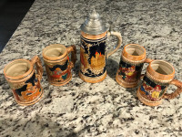 Vintage German beer stein with two pairs of Japanese stein mugs
