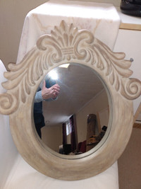 Mirror with ornate wood frame