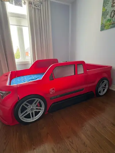Excellent condition Racing Car Bed, Mattress and Wood Slat Mattress Support. All purchased 2 years a...