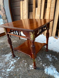 Antique cherry wood coffee table. Beautiful finish with brass