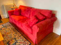RED SOFA WITH QUEEN SIZE PULL OUT