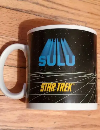 Beam aboard with this vintage Star Trek Sulu mug! This collectible mug features a vibrant design of...