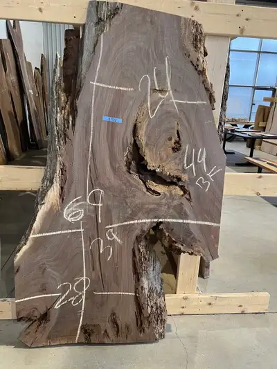 Beautiful black walnut slab with tons of character, natural live edges, and unique voids perfect for...
