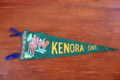 Hi. I have a vintage pennant - Kenora, Ont. for sale. The pennant shows some wear and marks. It meas...