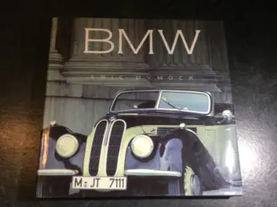 BMW: A Celebration by Eric Dymock Traces the history of BMW, looks at notable models of its automobi...