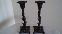 A pair of antique  candlesticks.
