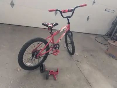 This is a Rush Model Moveo 14-inch kids' bike that is in used condition and comes with training whee...