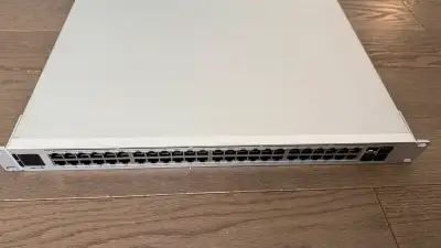 This is a pre-owned Ubiquiti UniFi USW-Pro-48-PoE network switch, a high-performance solution for yo...