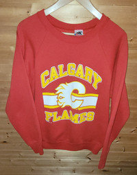 Percy's Vintage & Collectables - 🔥CALGARY FLAMES🔥 The symmetry of this  vintage Calgary Flames jersey are absolutely nuts! It's got a huge  embroidered Flames logo on the front too. This and a