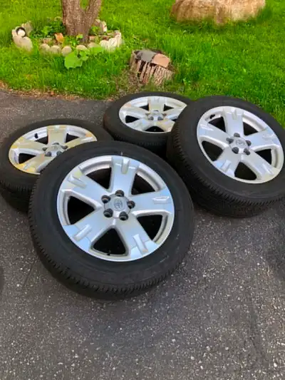 Toyota RAV4 or Toyota Sienna set of four 235/55R18 NEW Bridgestone all season tires Toyota Alloy rim...