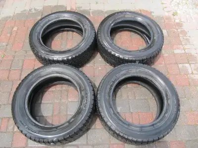 Up for sale is a four piece lot of Yokohama Ice Guard Studless 215/60R16 95R Snow Tires in virtually...