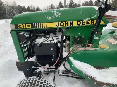 1987. 318 John Deere lawn tractor with cutting deck and push blade all hydraulically ran, has a 3 po...