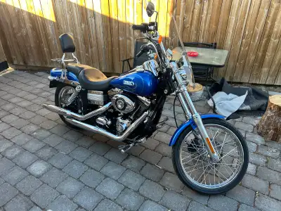 2007 HD Dyna WideGlide with only 23,000 kms. Windshield, leather bags, backrest with rack. Custom ai...