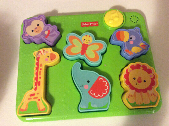 Fisher Price plastic animal puzzle, plays music in Toys in Moncton