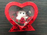 Gift red heart,inside white bear with flowers.