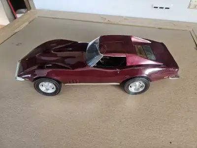 1968 Jim Beam bourbon whiskey decanter. Still full of whiskey, has a Crack on the windshield. Asking...