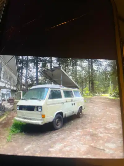 This is an air cooled 1982 Volkswagen Westfalia Camper van. It has the full kitchen with sink, stove...