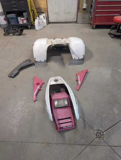 I have all the plastics for polaris 325 they are red and white. With the seat being red and in very...