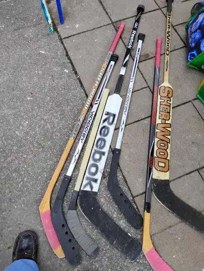 Assortment of hockey sticks, View more