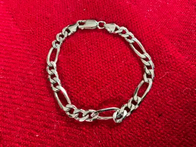 A vintage Italian silver chain 8” bracelet marked “Italy” and “925” silver which stands for Sterling...