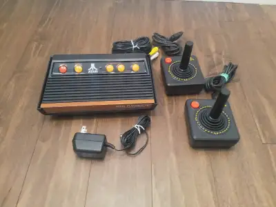 Atari Flashback 2+ game console with 2 joysticks. Has 40 Atari classic games built in. See details a...