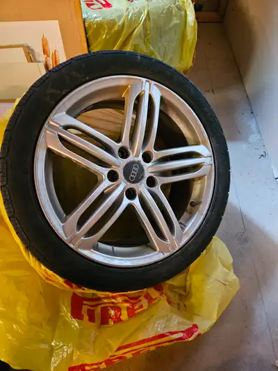 Used 17 inch Audi wheels. One rim has tire removed. 4 rims one has no tire. Wheels are aftermarket $...