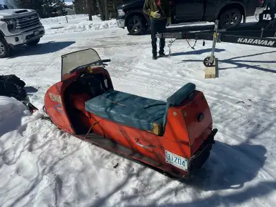 This vintage Bouchard snowmobile, with a 1966 model and serial number 1257807, is a piece of history...