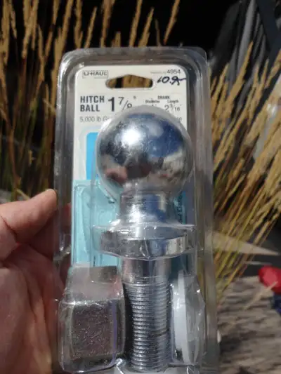 1 New in the package Uhaul 1 7/8" Trailer Ball Hitch & 1 black used Trailer Draw Bar a) U-Haul Brand...