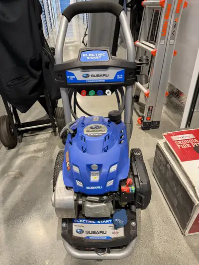 Lightly used 3200 psi gasoline powered power washer with 25 ft high pressure water hose, 5 separate...