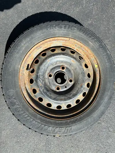 4 winter tires on Nissan rims Studded with lost of tread left Off a 1012 Nissan Versa