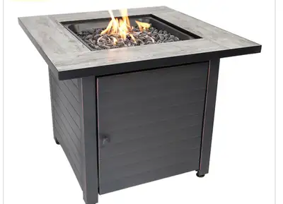 This Endless summer 30-inch square gas outdoor fire pit features a steel table insert, glass rocks a...