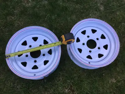 Two - 12 x 4 in. 5-Bolt Trailer Rims. Like new. Used as a template for a project, never mounted. Bol...