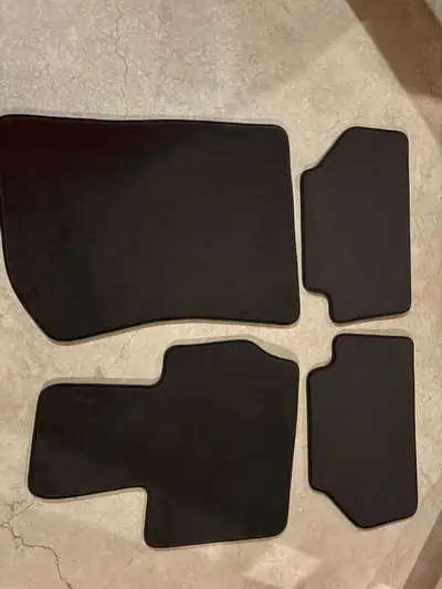 Black carpet BMW floor mats for X 3 vehicle, set of 4, brand new.