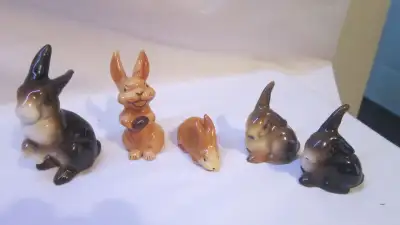 This set of rabbits are in good used condition. The larger rabbit has a crackled glaze from age. Ple...