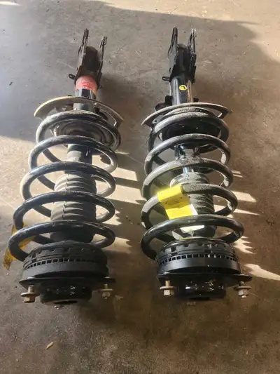 Left and Right front struts for 2018 dodge caravan. One is 1yr old and the other is 4 months. Put ne...