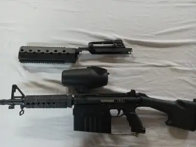 Tippmann A5 in heavy weapons configuration with M249 stock. M16 shroud and a remote flex hose includ...