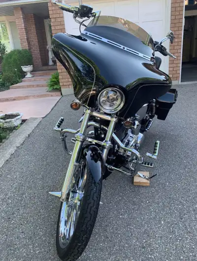Posting for a friend, 2005 Harley Davidson Sportster XL1200 Custom. Low mileage, chrome wheels 21 in...